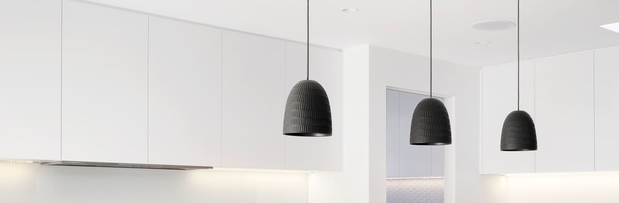 black lighting pendants in white room
