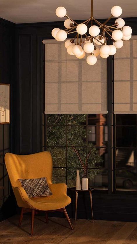 Modern chair in dark paint room with Lutron technology