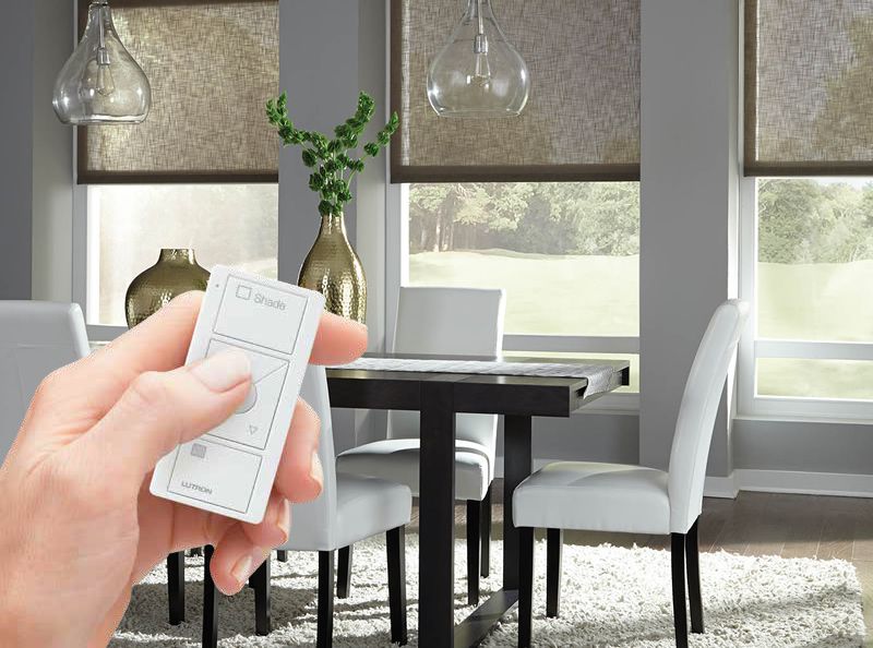 lutron shading with person holding remote