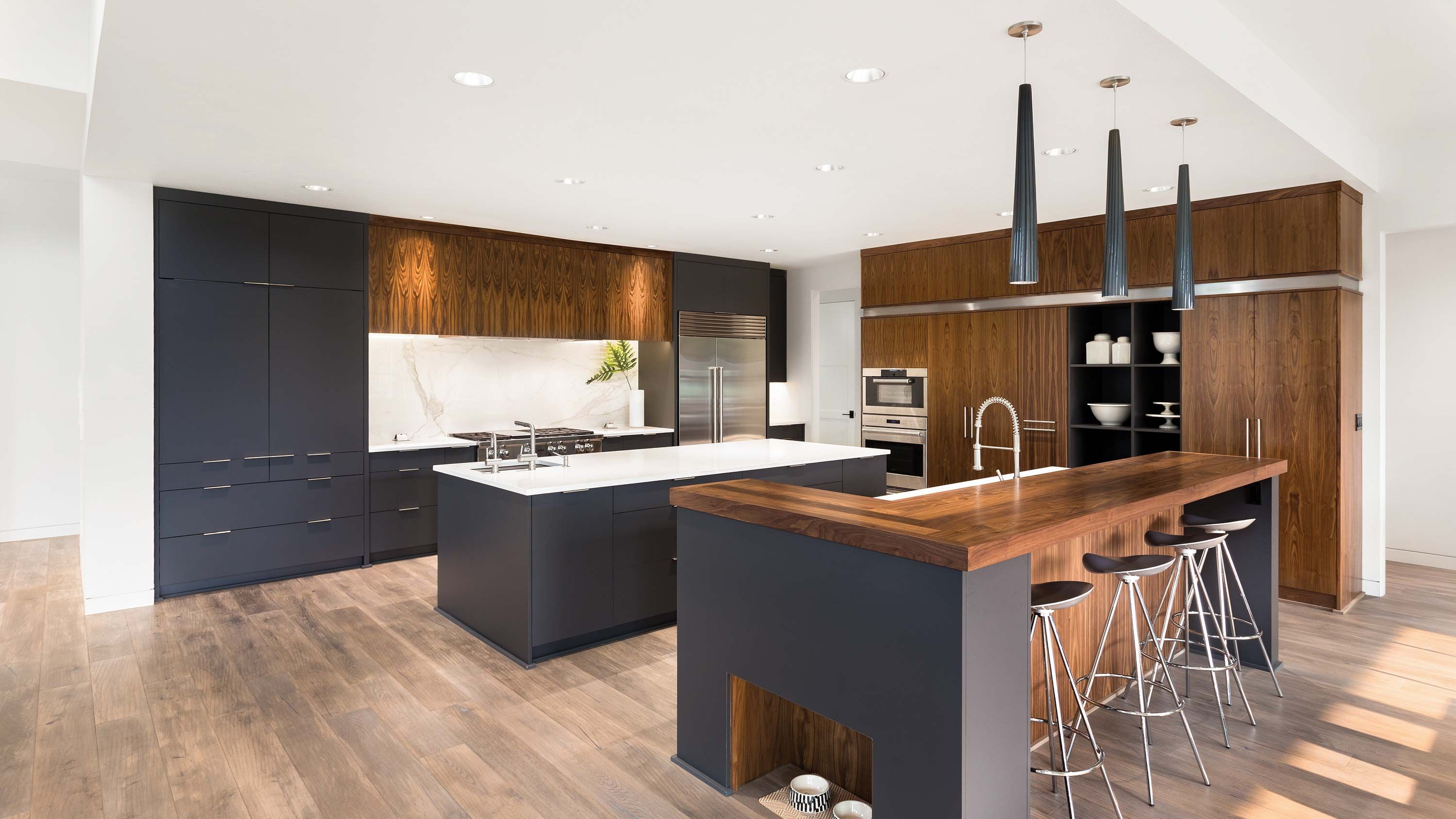 blue cabinets and wood accents in a kitchen with sonance technology